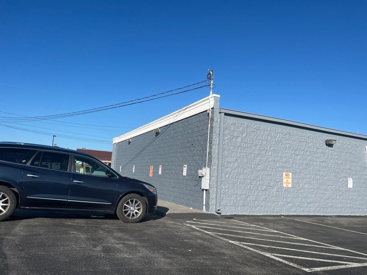 Store side wall after repaint — recoated in charcoal